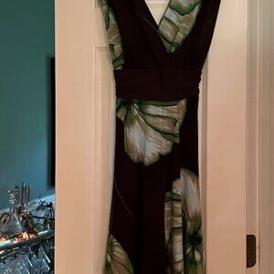 Stylish polyester wrap dress with beautiful colors on brown background.